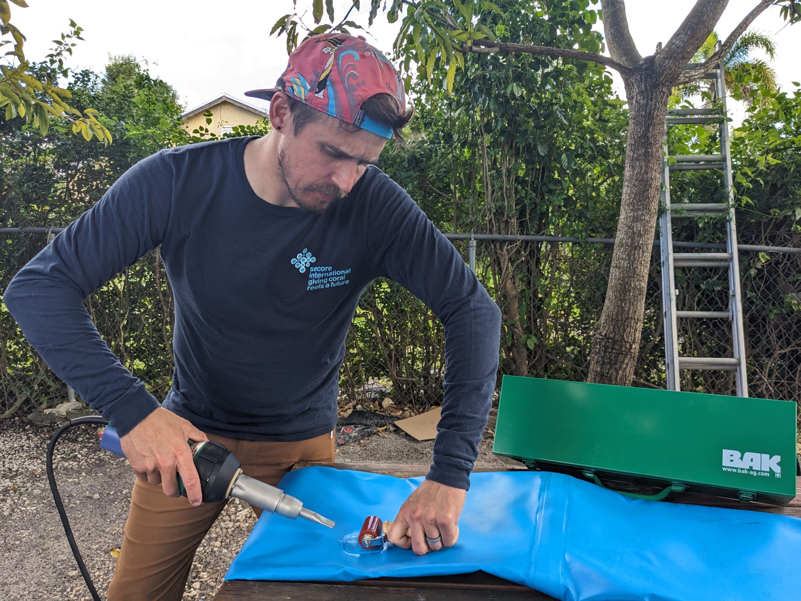Welder fixing plastic inflatable using patch welding